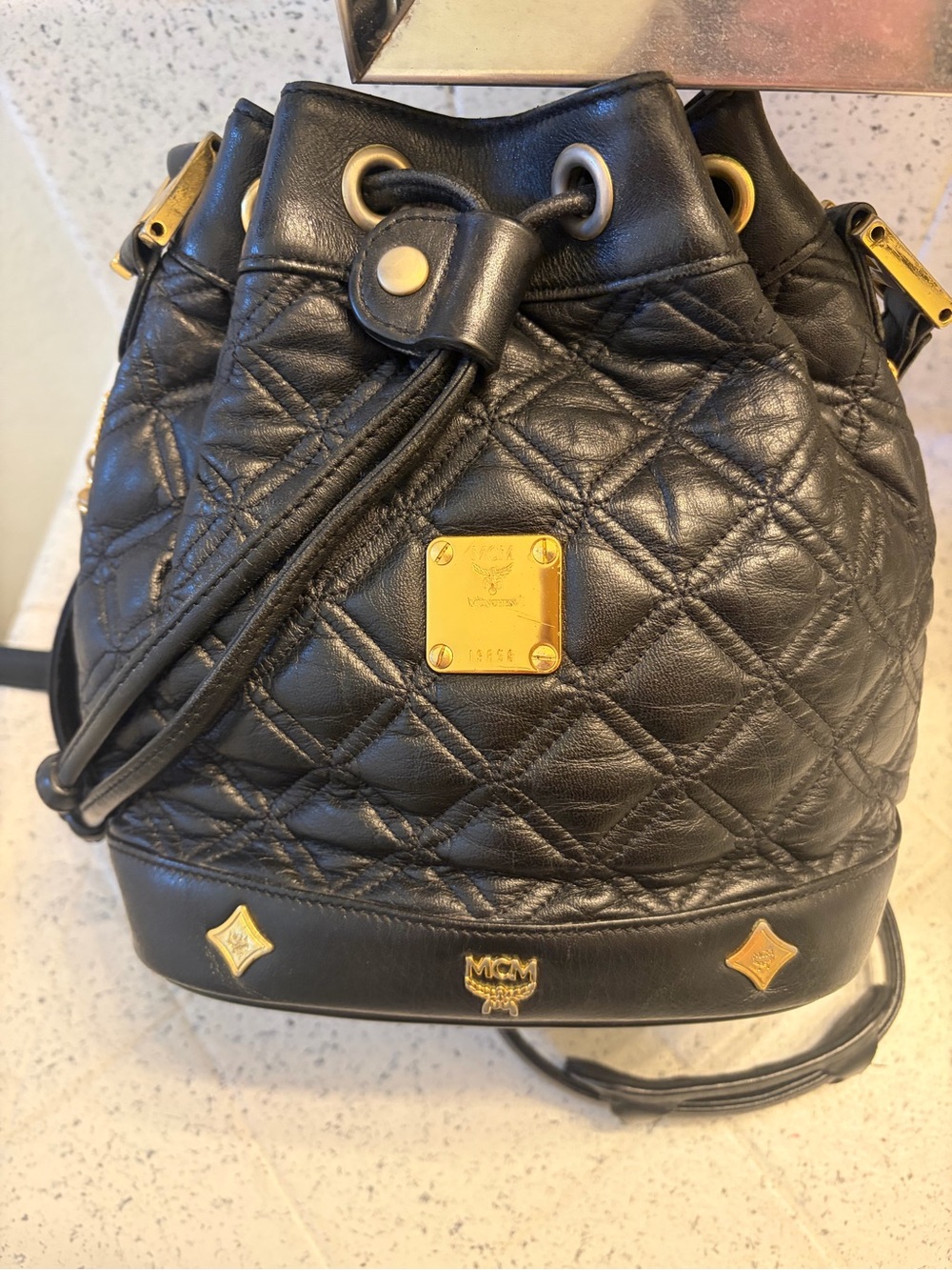 MCM Black Quilted Leather Drawstring Backpack with Gold Hardware